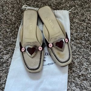 Rare heart cream emblem Prada mules